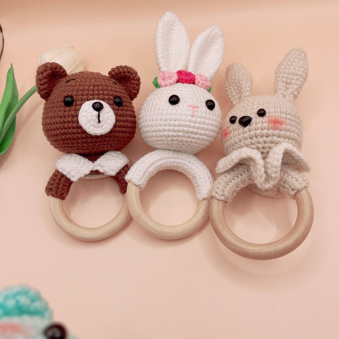 Stitchery Zone Animal Crochet Rattle baby toys featuring crocheted bear, bunny, and rabbit heads with wooden rings