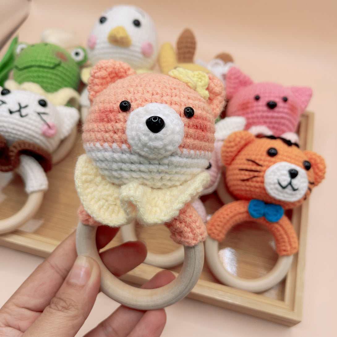 Animal Crochet Rattle featuring a handmade crocheted bear with wooden ring for babies by Stitchery Zone
