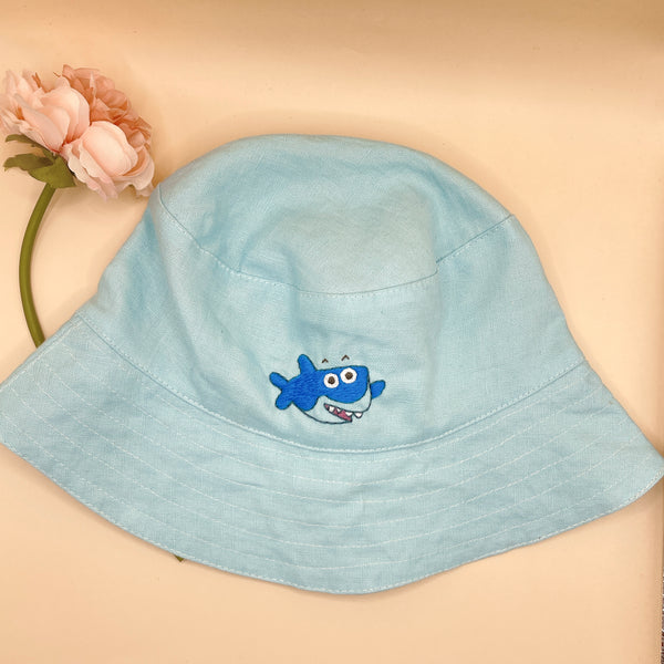 Stitchery Zone Baby Shark Embroidered Linen Baby Hat in light blue with cute shark design