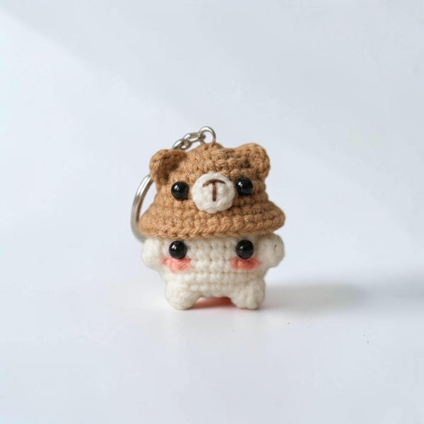 Cute crochet bear keychain in brown and white with beaded eyes, perfect for personalization and everyday use