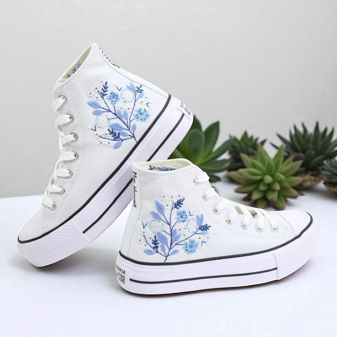 White embroidered high top Converse Shoes Wedding with blue floral design on side and white rubber sole