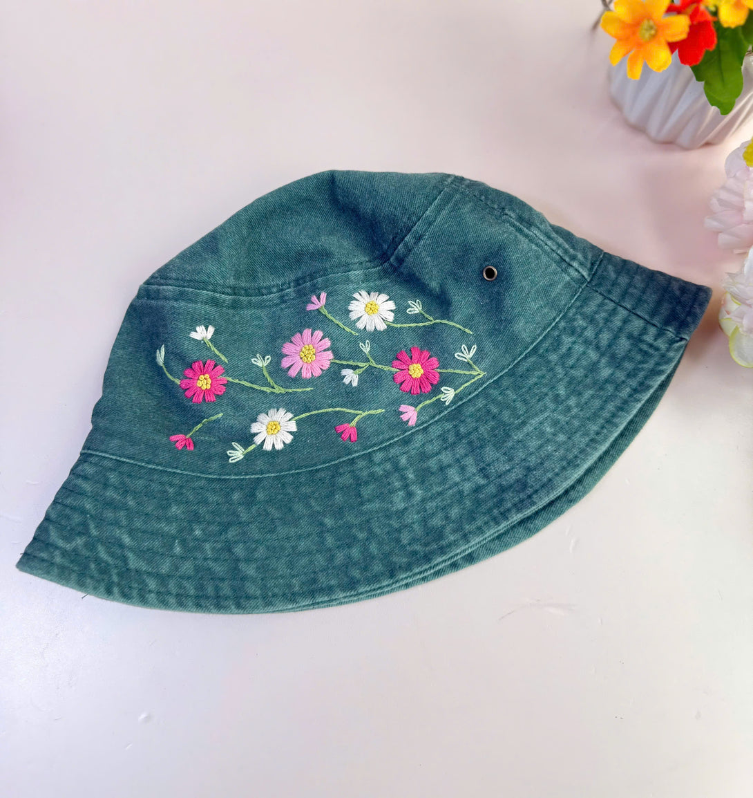 Stitchery Zone colorful flowers hand embroidered bucket hat in dark green with pink and white floral design