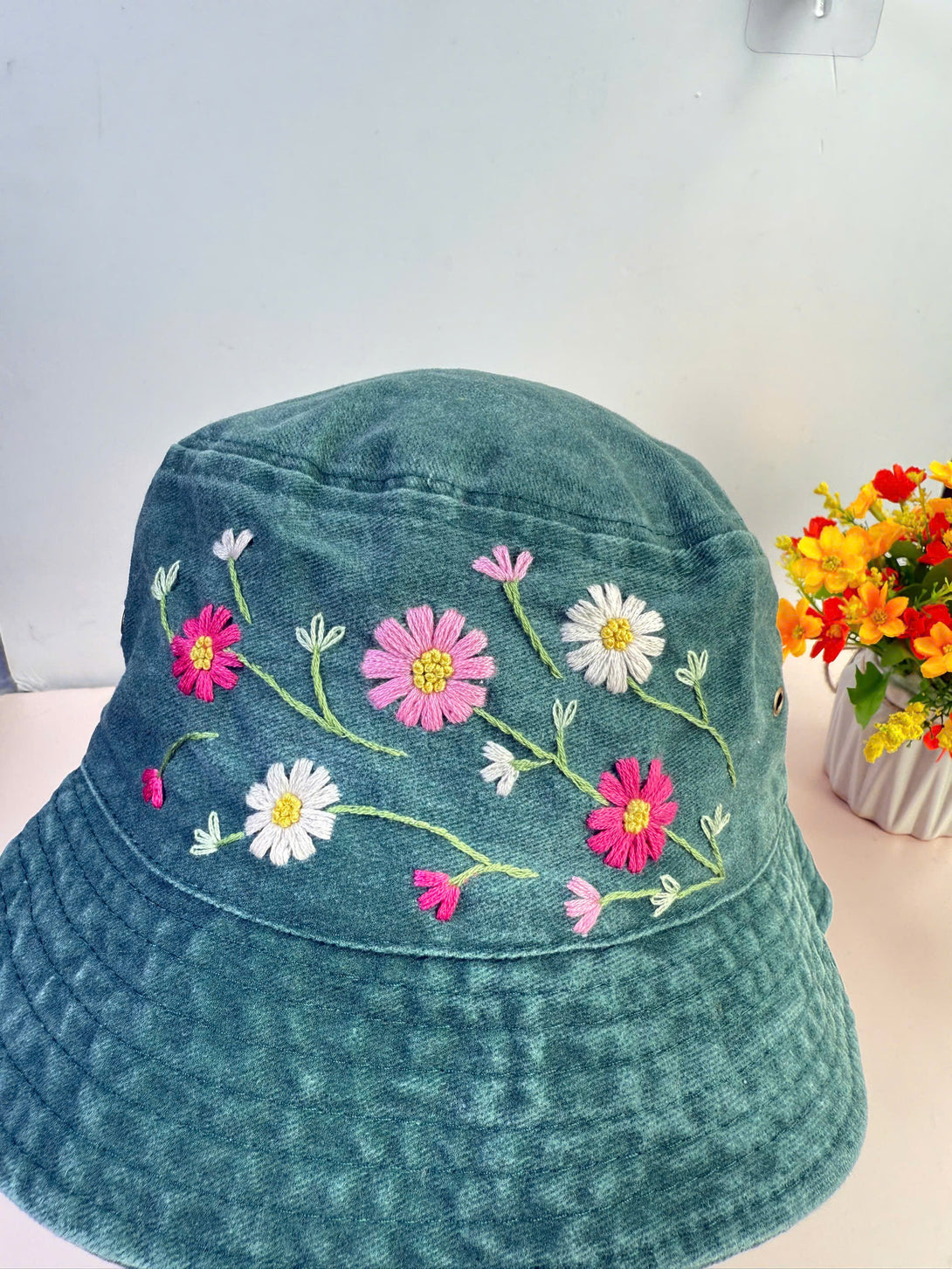 Colorful Flowers Hand Embroidered Bucket Hat in teal with pink white flower designs by Stitchery Zone