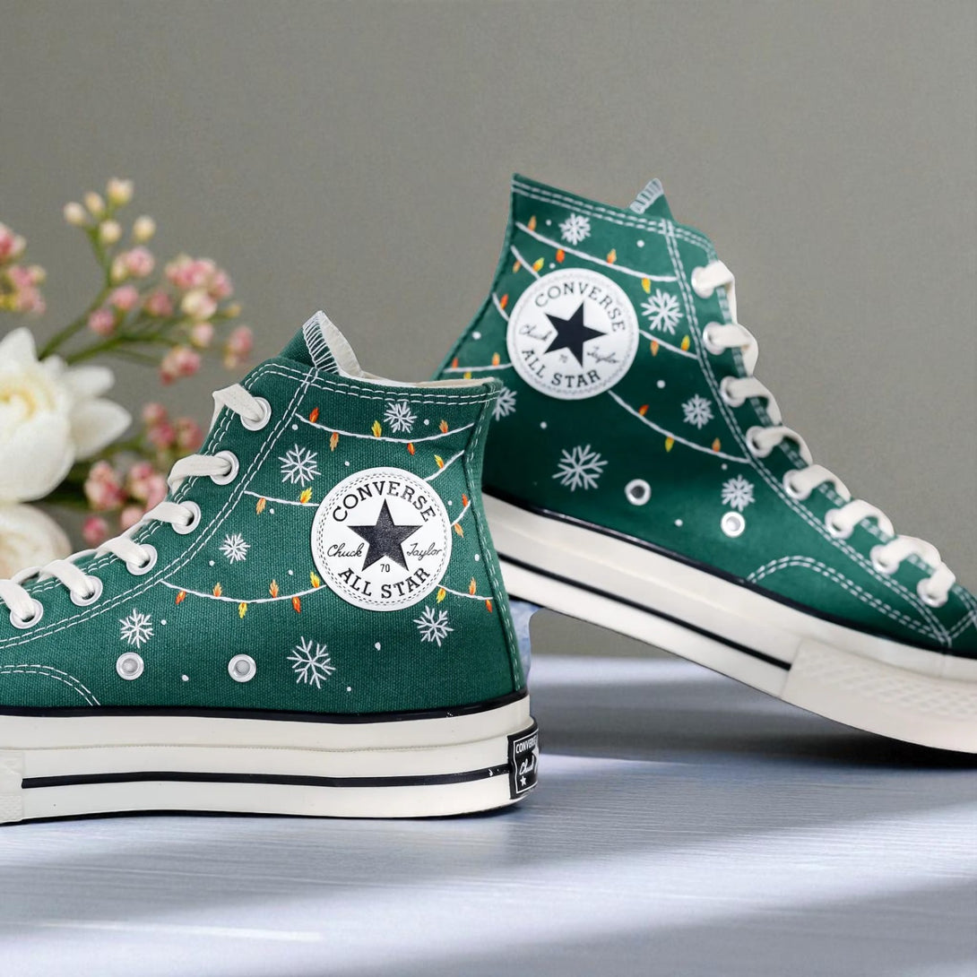 Converse embroidered green high top Christmas Chucks with white snowflakes string lights and All Star patch