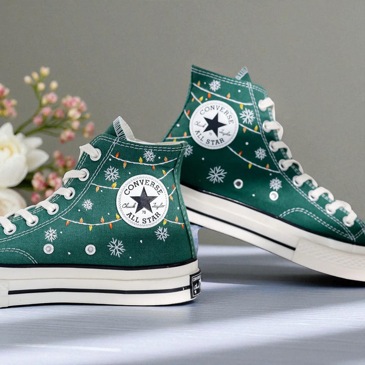 Converse embroidered green high top Christmas Chucks with white snowflakes string lights and All Star patch