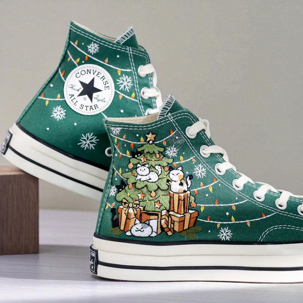 Converse embroidered high top Christmas Chucks in green canvas with embroidered tree gifts cats and string lights