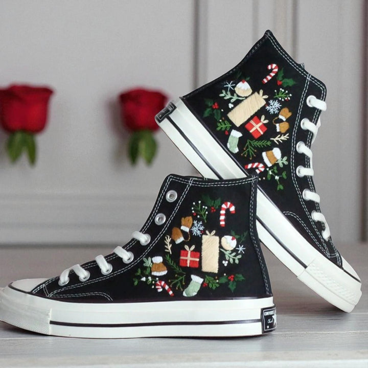 Christmas Converse 2025 black embroidered high top shoes with candy canes gifts holly and white soles
