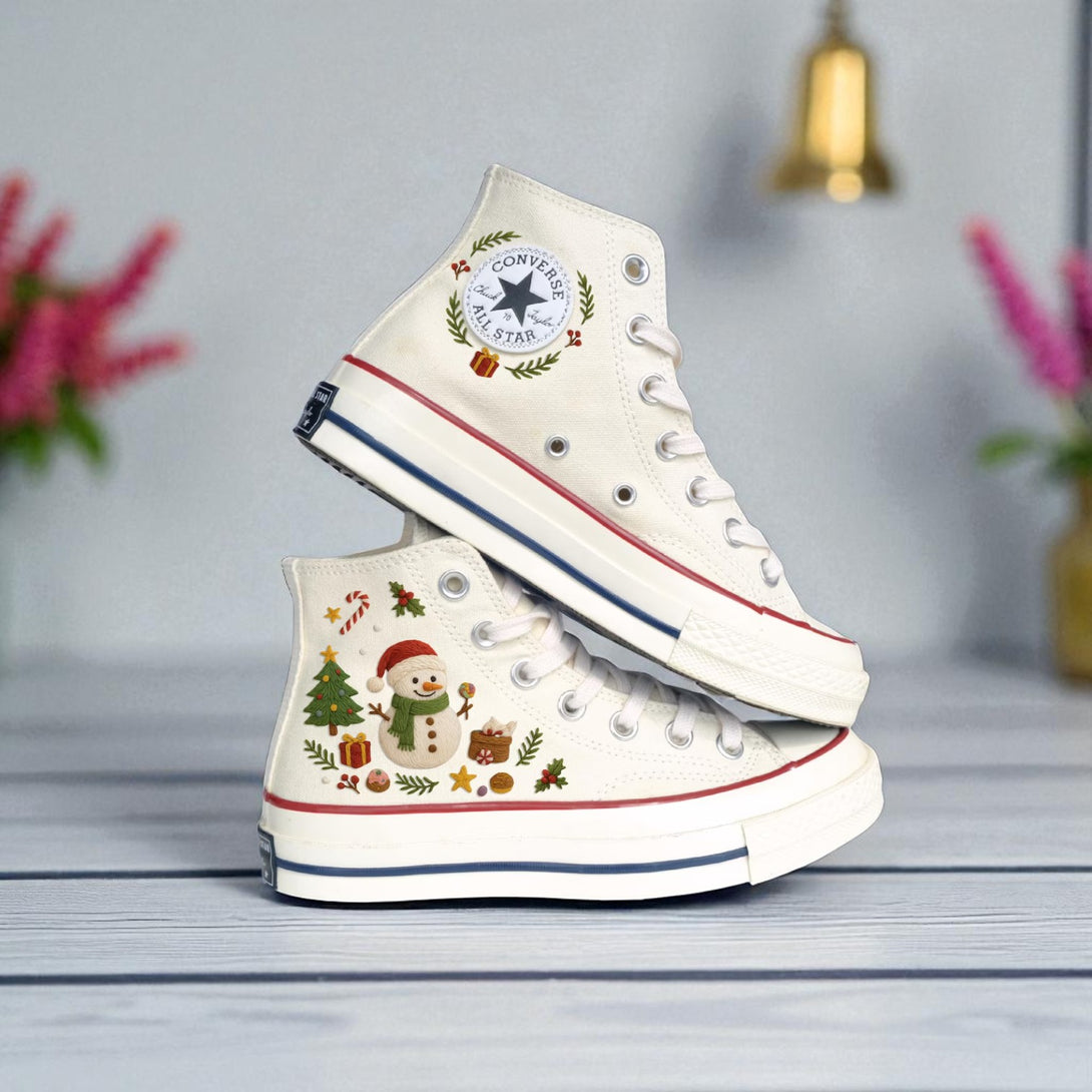 White high top embroidered Converse shoes with festive snowman Christmas tree wreath and gift motifs christmas converse