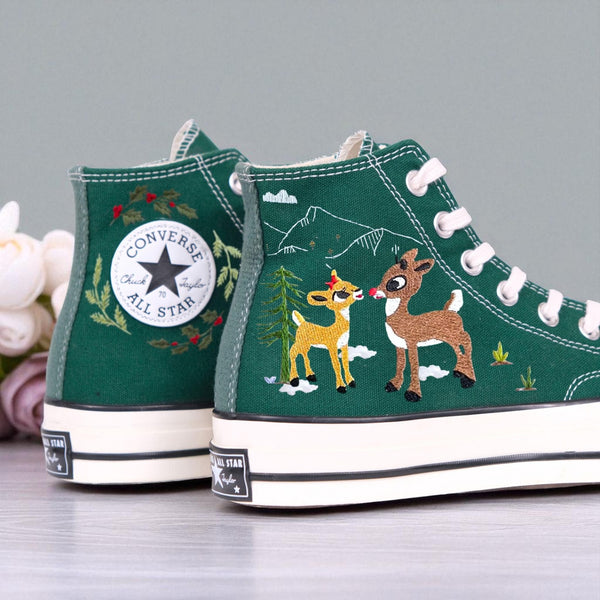 Pair of green embroidered Christmas Converse High Tops with reindeer and wreath holiday design