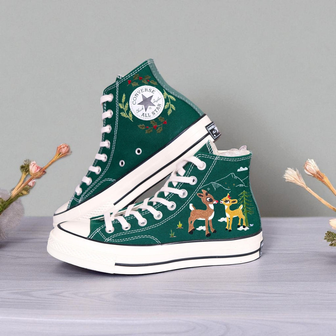 Green embroidered Converse high top sneakers with reindeer and wreath details on white soles Christmas Converse High Tops