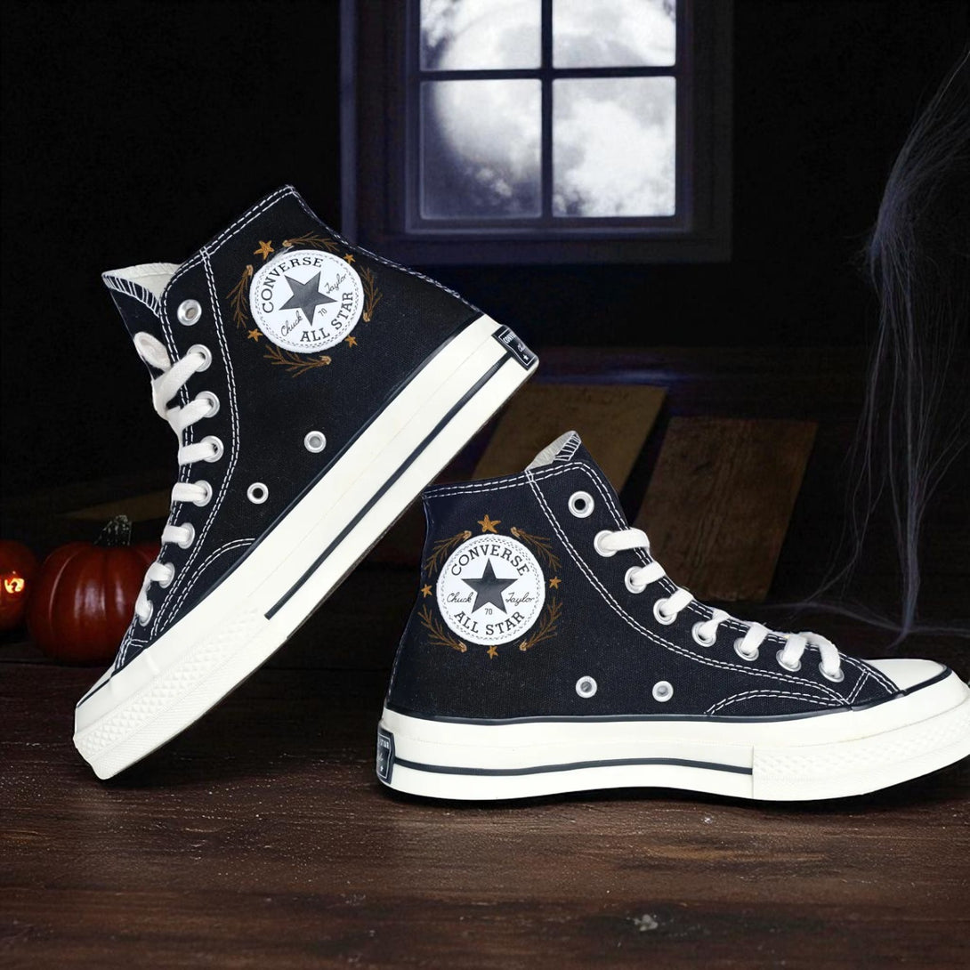 Converse Halloween black high top embroidered shoes with white laces and All Star patch in spooky setting