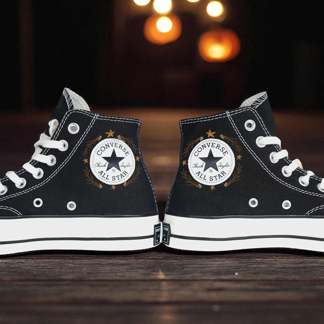 Converse Halloween black embroidered high top shoes with white sole and pumpkin background