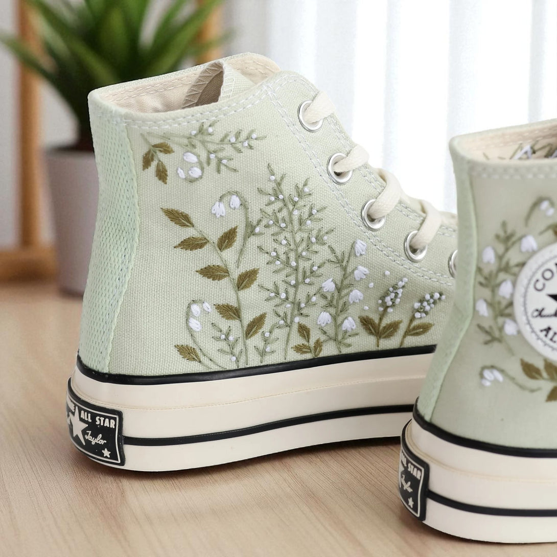 converse sage green embroidered canvas high top shoes with white floral embroidery and platform sole