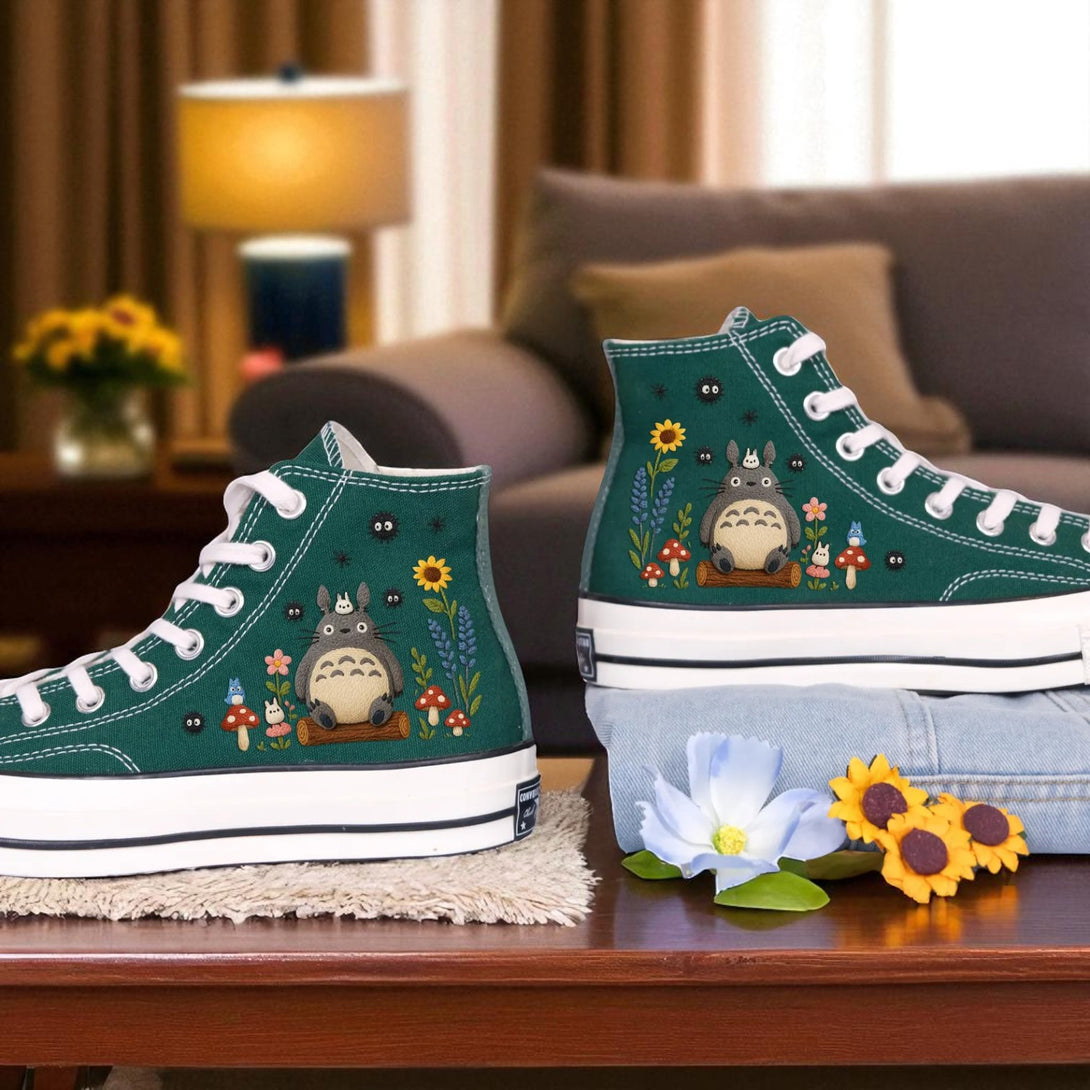 Cute Converse embroidered shoes featuring Totoro and floral designs on a cozy living room setting