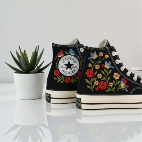 Floral Converse high-top shoes with vibrant embroidery and classic All Star logo