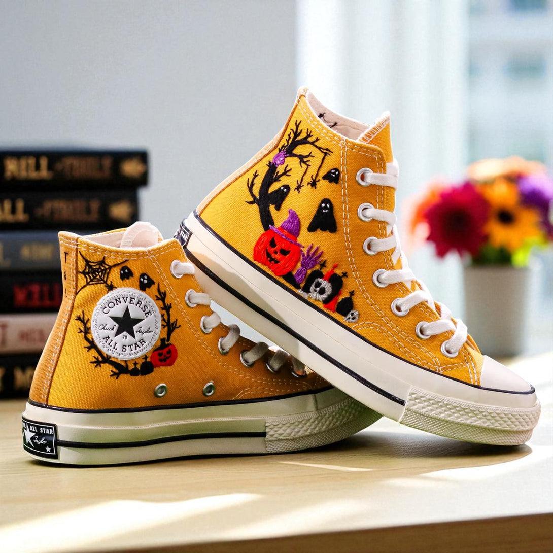 Converse embroidered high top shoes in yellow featuring Halloween Converse pumpkin ghosts spiderwebs and stitched skulls
