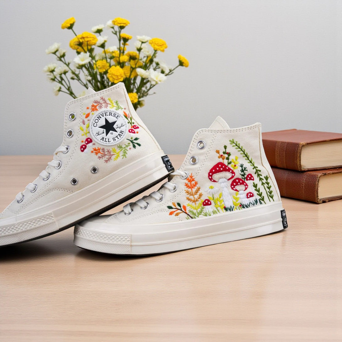 White Converse embroidered shoes featuring a vibrant mushroom shoe design with floral accents