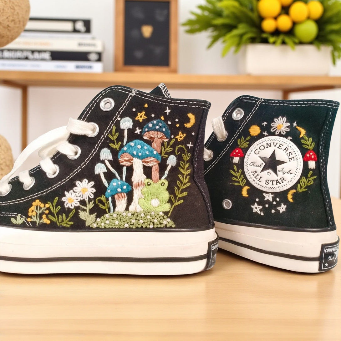 Converse Mushroom Shoes featuring vibrant embroidered designs of mushrooms and a frog on a black canvas upper