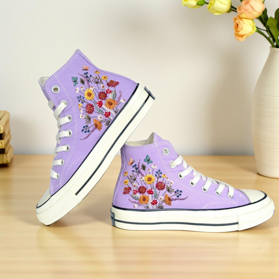 Converse shoes with mushrooms featuring colorful floral embroidery on a lavender background