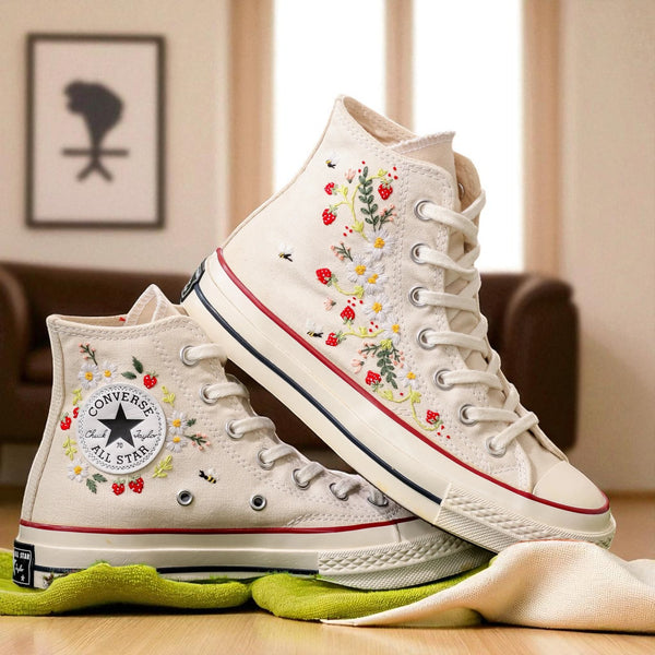 Converse embroidered strawberry shoes with floral designs and classic high-top silhouette
