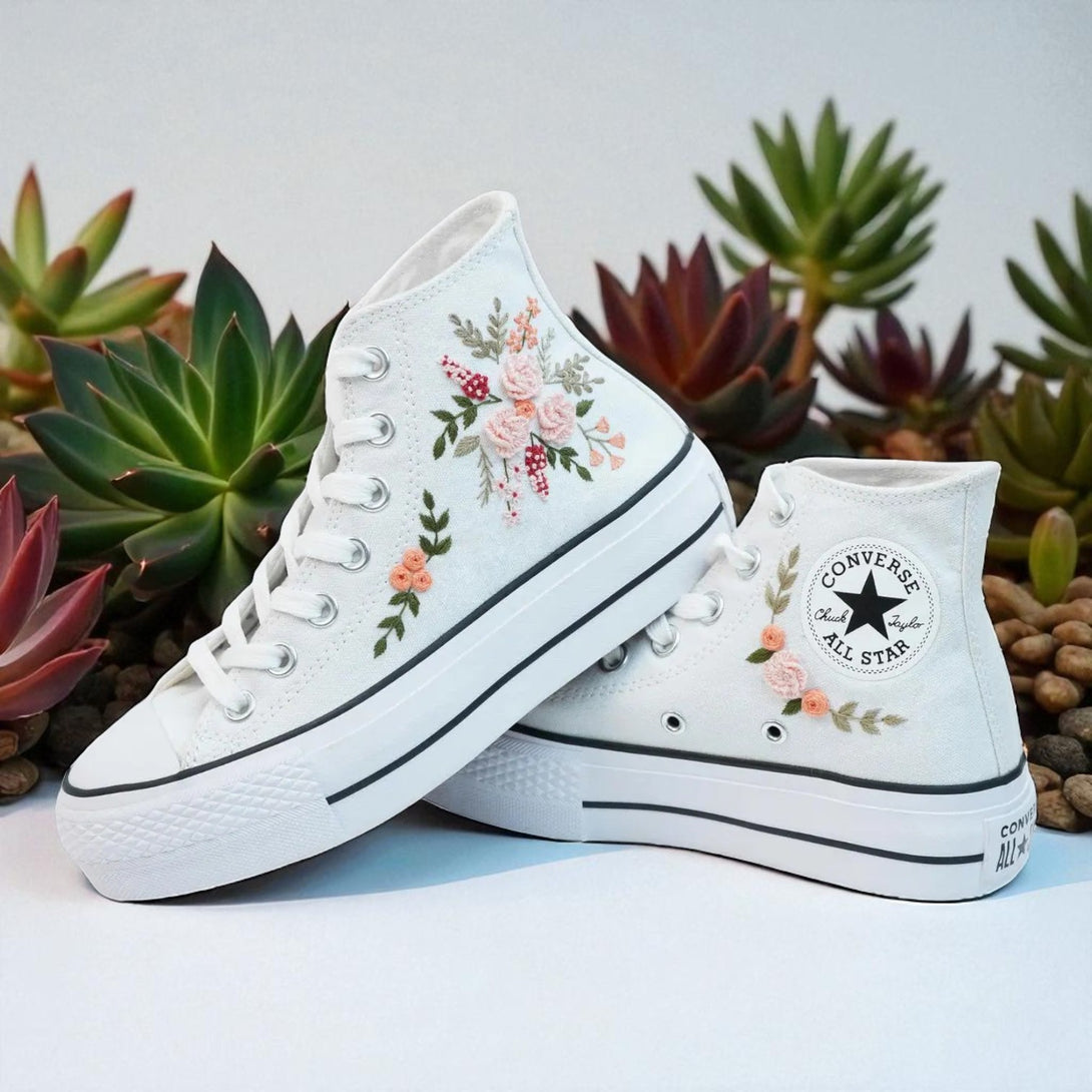 White Converse high top embroidered shoes with pink floral rose embroidery and All Star logo on white canvas
