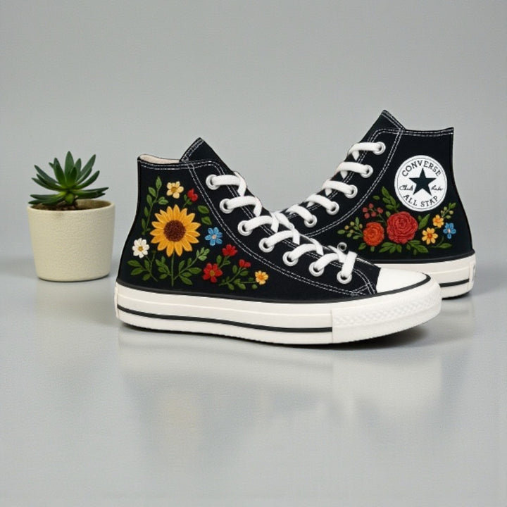 Converse with roses featuring colorful floral embroidery on a classic black high-top design