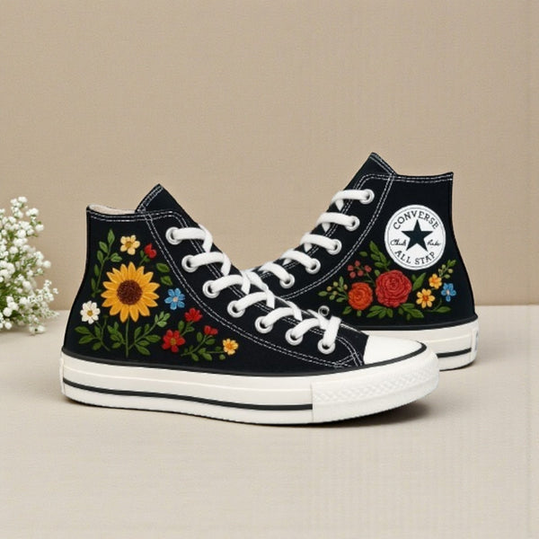 Converse with roses featuring vibrant floral embroidery on a classic black high-top silhouette