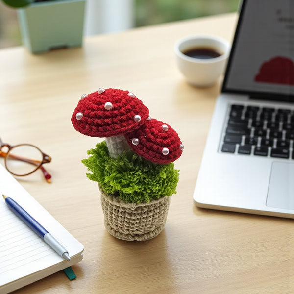 Crochet mushroom decor with red caps and green base, ideal for home or office decoration
