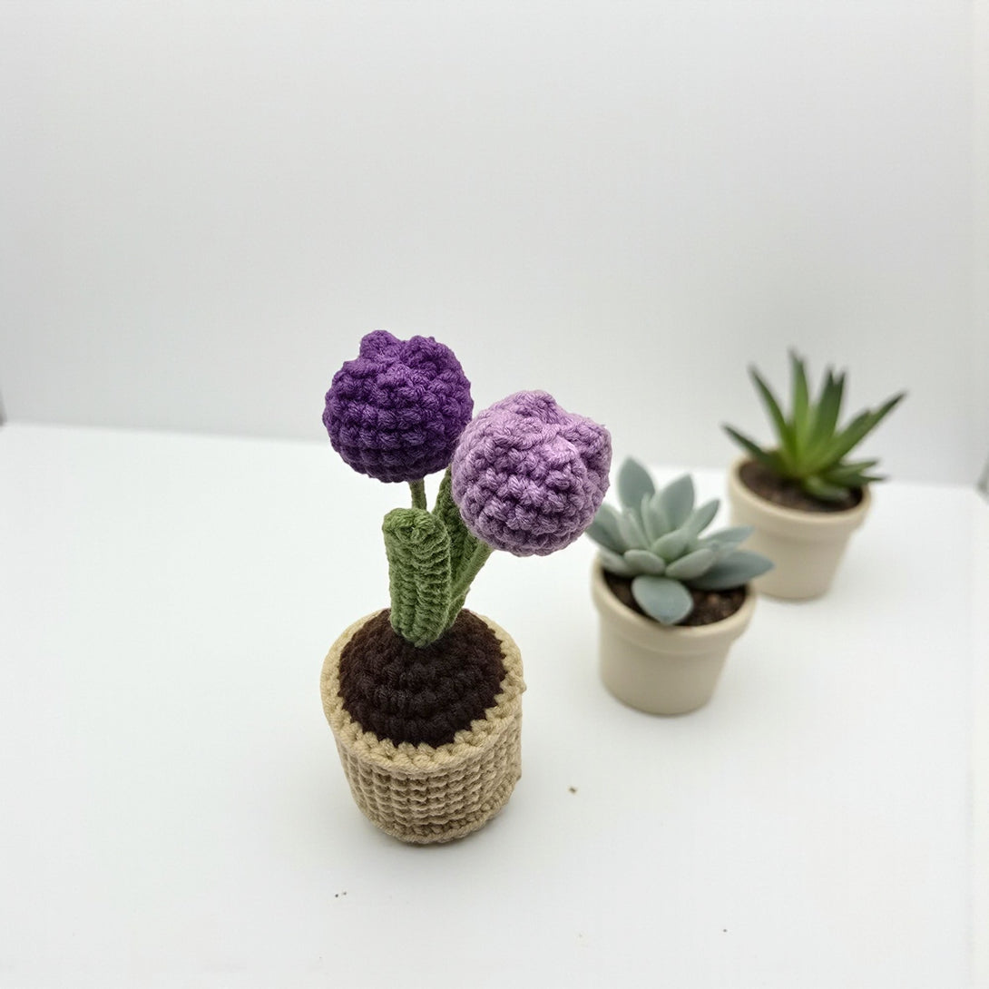 Handmade crochet tulip in pot featuring three purple blooms with green stems