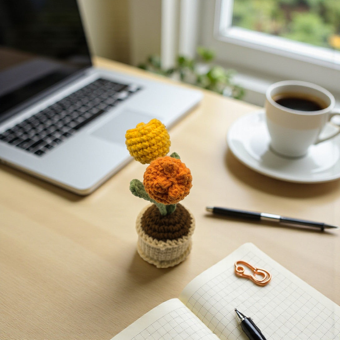 Crochet tulip decor in a pot, perfect for adding a vibrant touch to any workspace