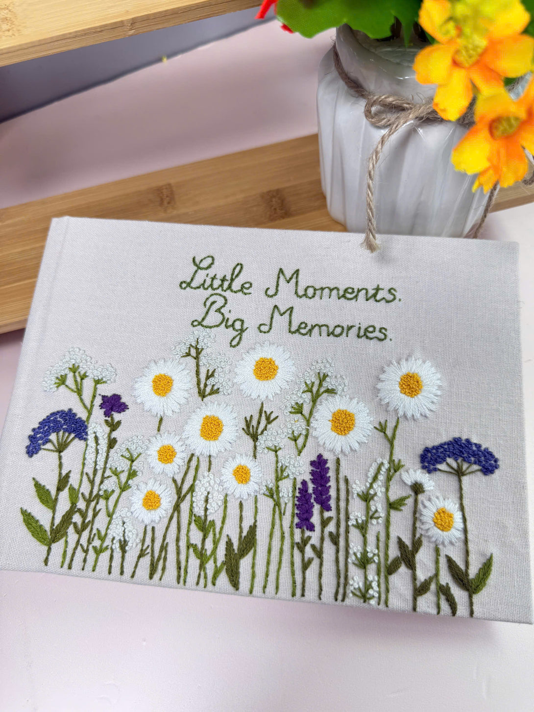 Notebook with Custom Fabric Cover with Floral Design featuring embroidered daisies and purple flowers