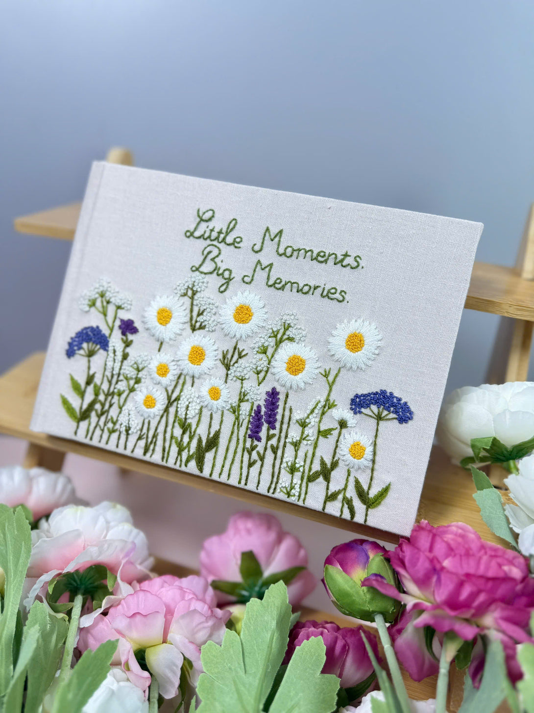Stitchery Zone notebook with custom fabric cover with floral design featuring embroidered daisies and lavender flowers