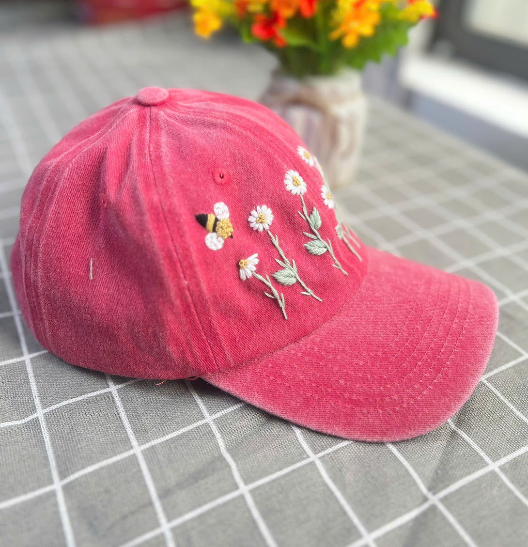 Stitchery Zone custom floral embroidery cap in pink with embroidered daisies and bee design