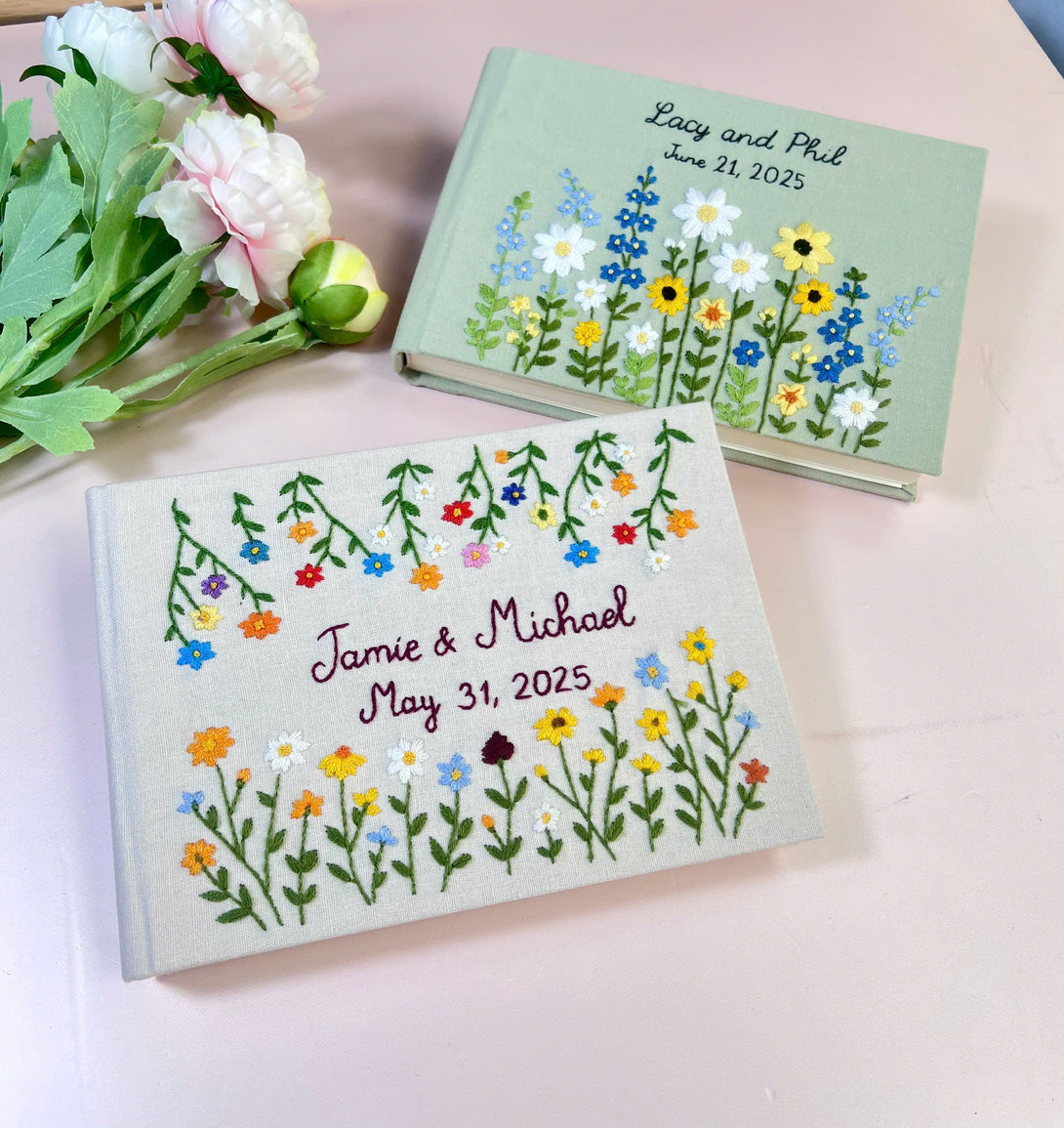 Custom floral guest book for weddings with embroidered flowers and personalized names on fabric cover