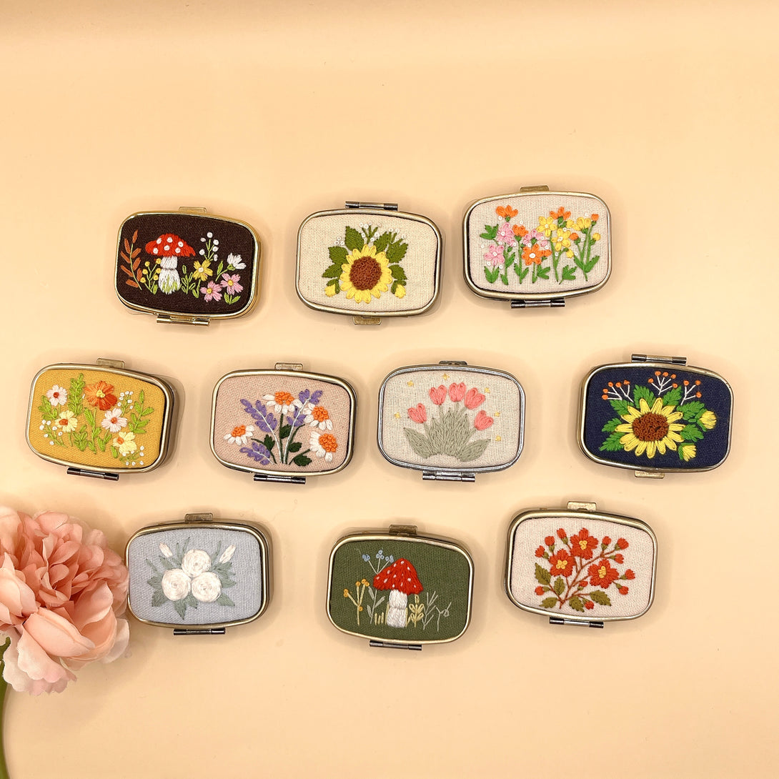 Stitchery Zone custom jewelry box mirrors with embroidered floral and mushroom designs in various colors
