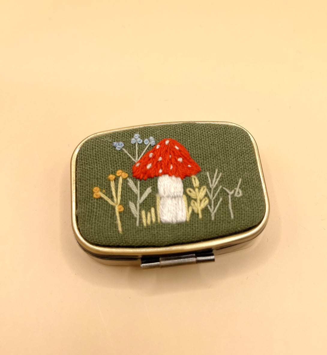 Stitchery Zone custom jewelry box with embroidered mushroom design on green fabric cover