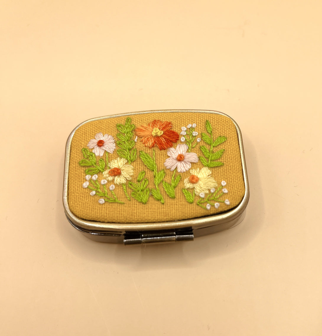 Stitchery Zone small hinged custom jewelry box with floral embroidery on yellow fabric cover