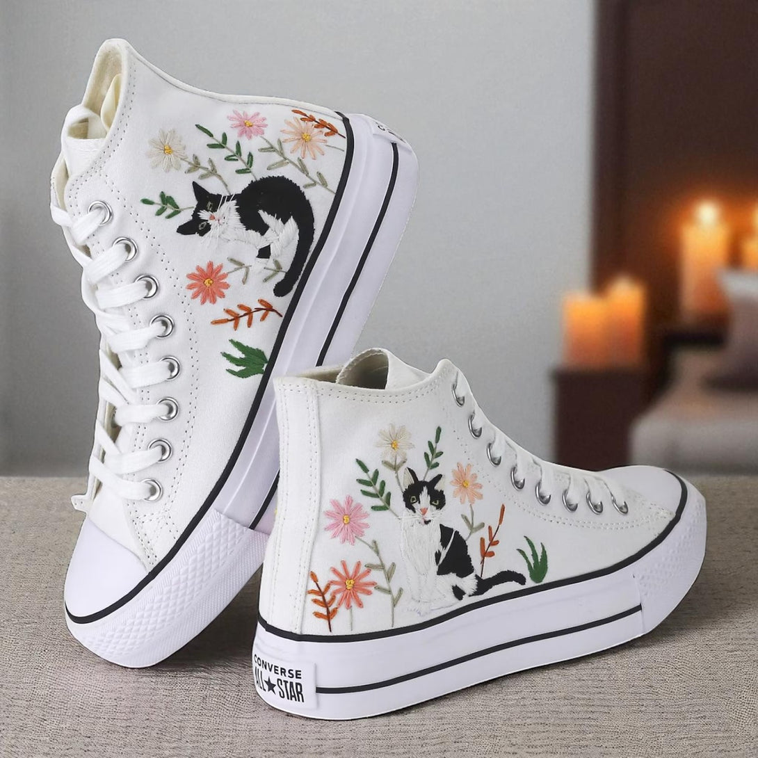 Cute Embroidered Converse sneakers featuring floral and cat designs for stylish casual wear