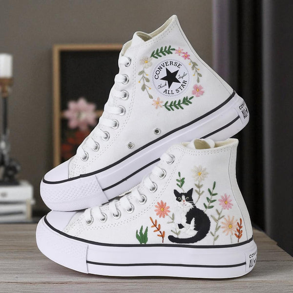 Cute Embroidered Converse shoes featuring floral designs and a black cat on white canvas