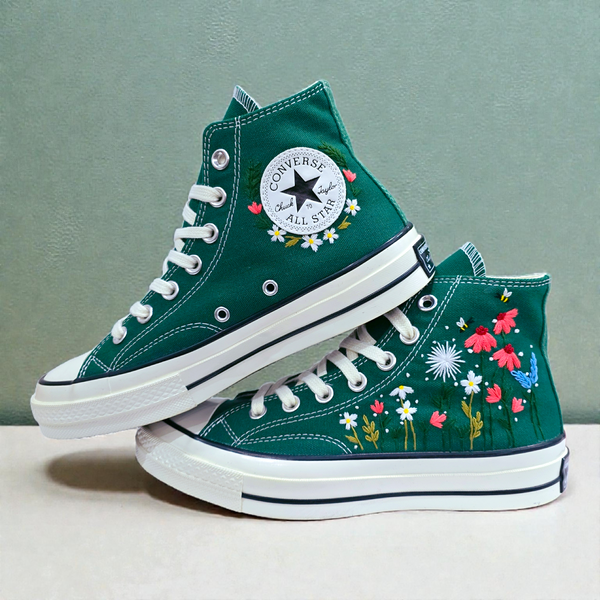 Dark green Converse high tops with floral embroidery on the sides for a stylish and personalized look