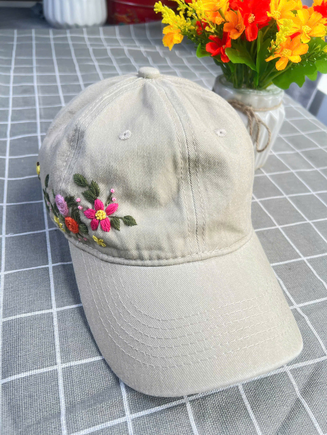Stitchery Zone embroidered hat in beige with colorful floral embroidery on side