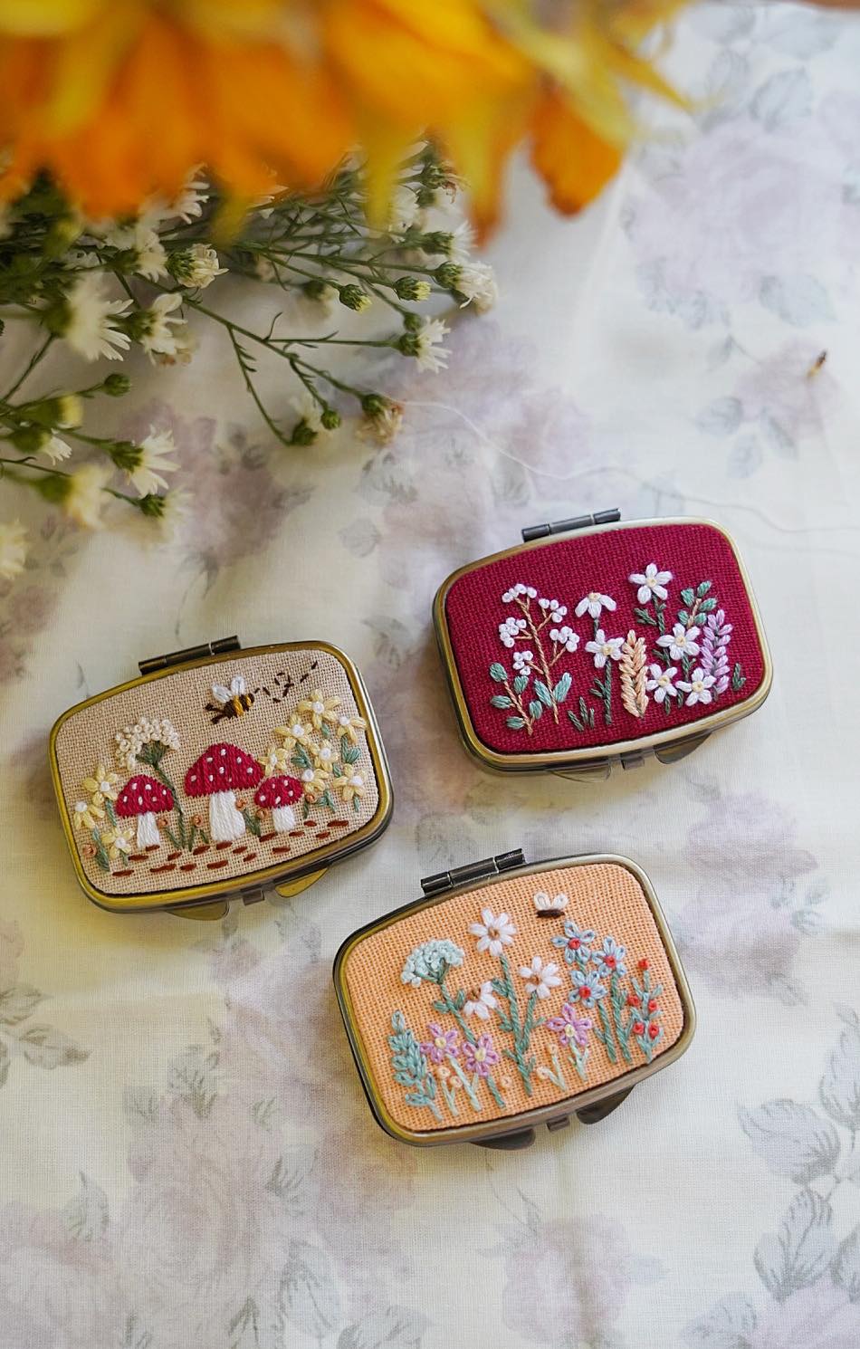 Stitchery Zone embroidered jewelry box set with floral and mushroom designs on fabric covers