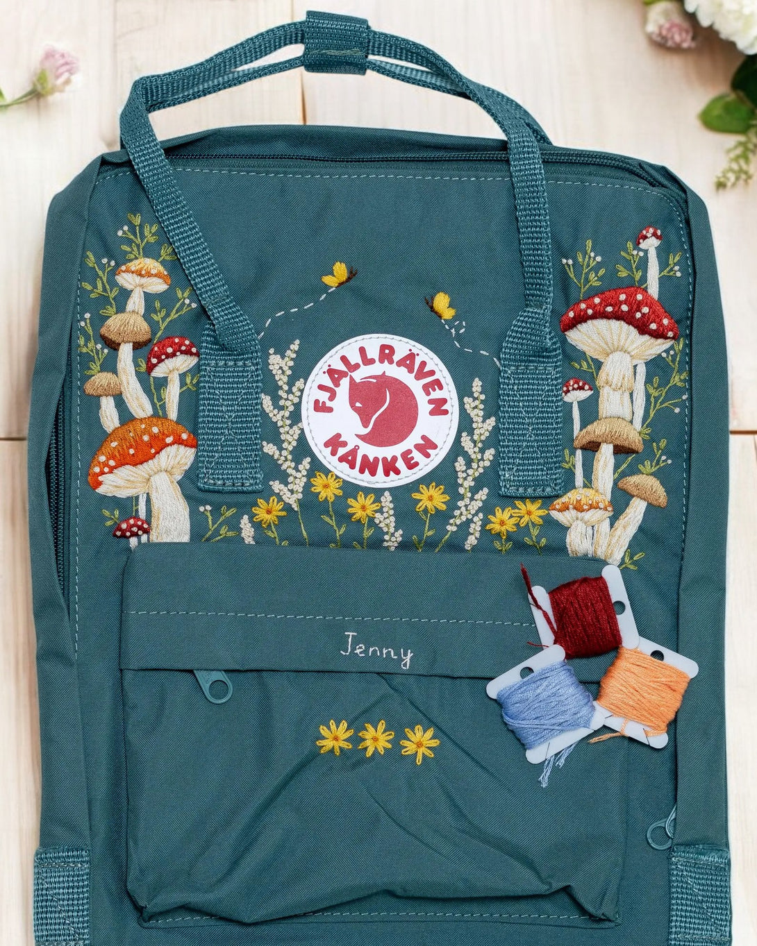 Turquoise Fjällräven Kånken Backpack with Floral Embroidery, ideal as backpacks for school