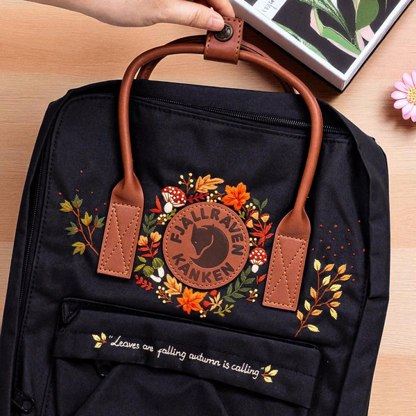 Classic Fjallraven Kanken Backpack black with leather handles and autumn floral embroidery