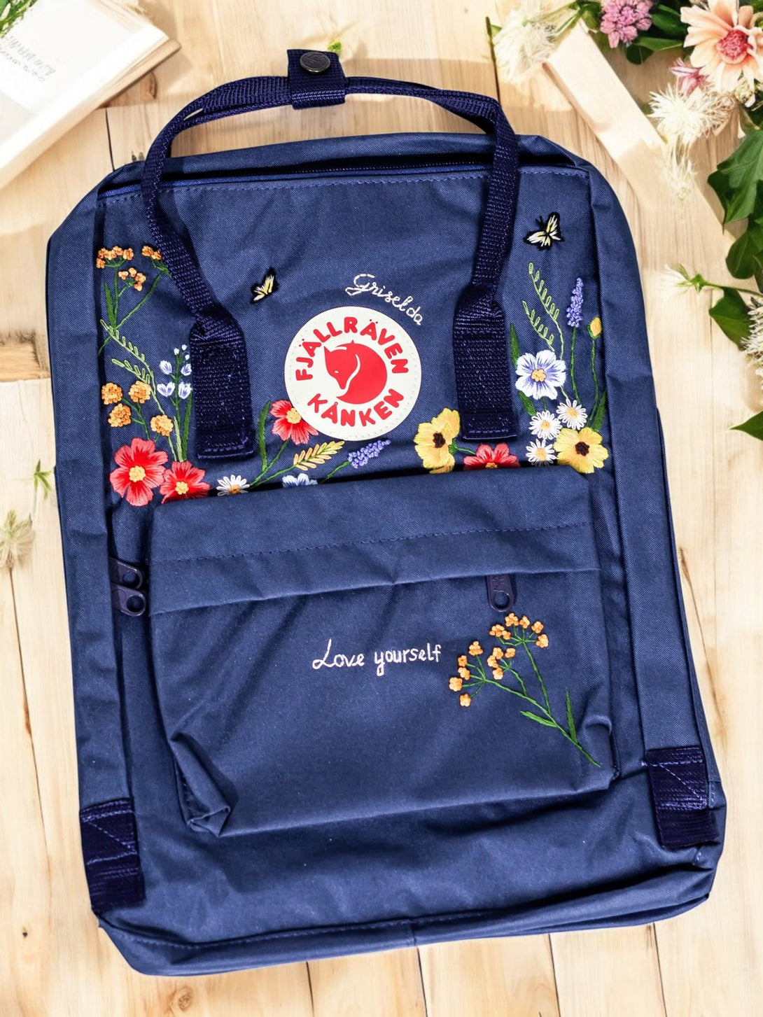 Stitchery Zone Kanken backpack laptop in navy with floral embroidery and front pocket