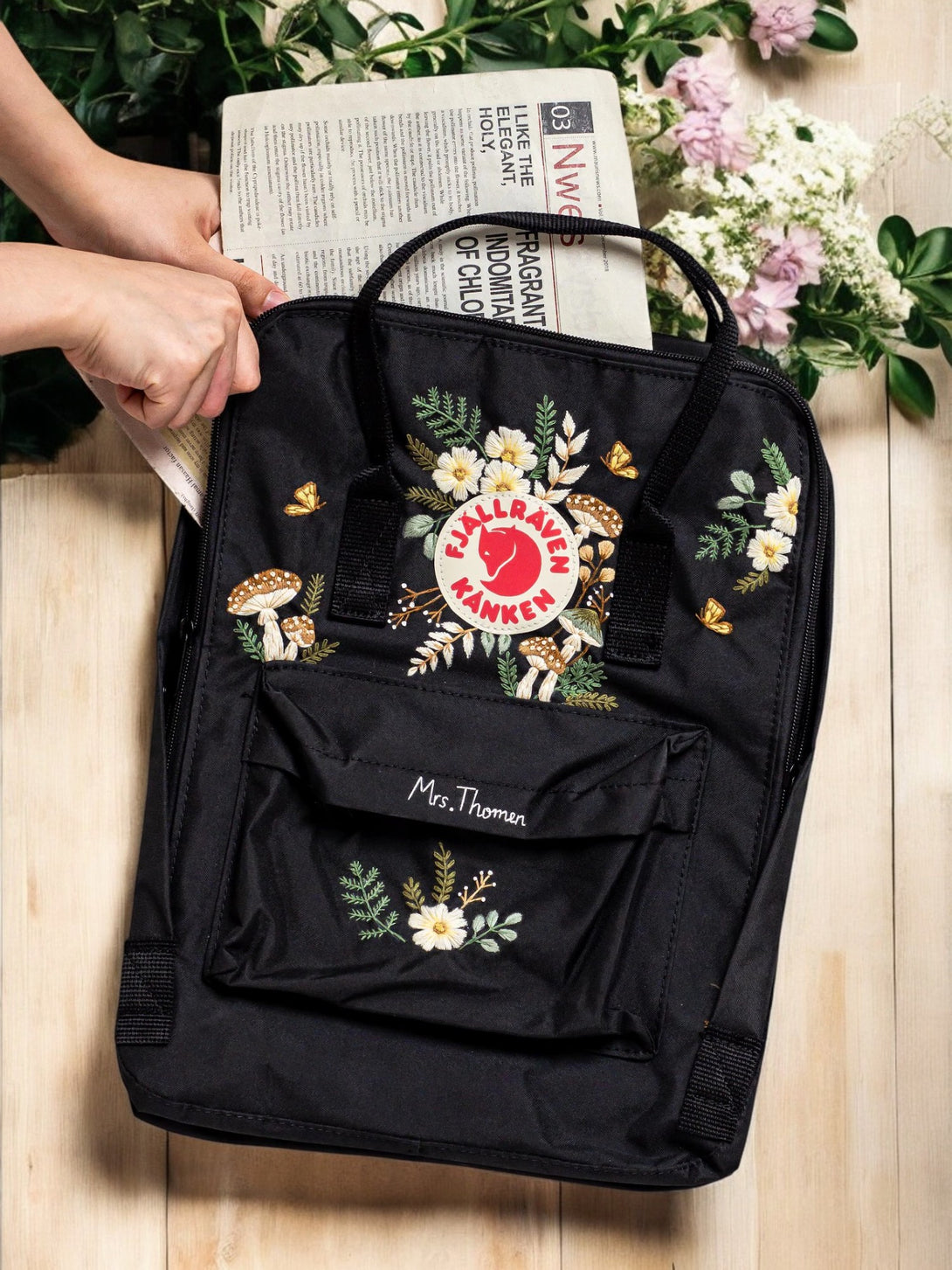 Fjallraven Kanken Laptop 15 Backpack in Black with Floral Embroidery and Front Pocket