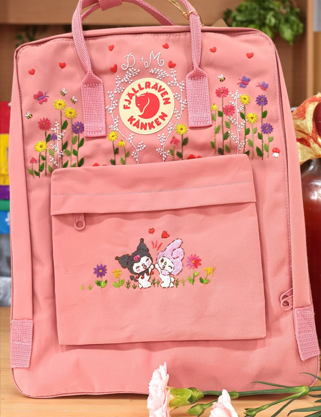 Embroidered pink Kanken laptop backpack with floral designs and cute animal motifs from Stitchery Zone