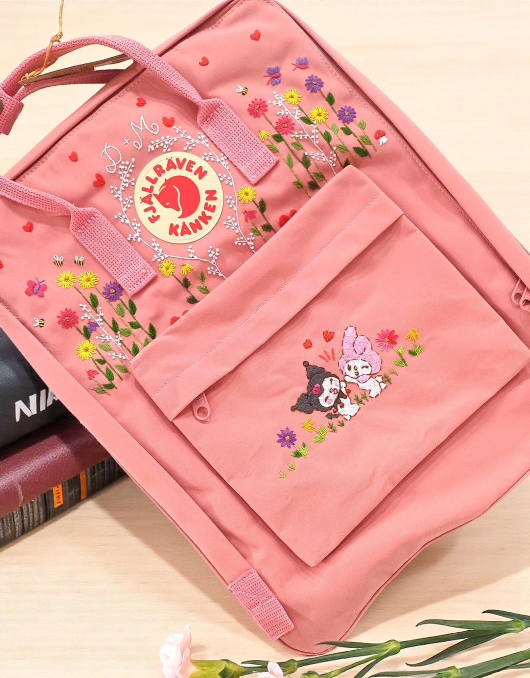 Stitchery Zone Kanken laptop backpack in pink with floral designs and cute character embroidery