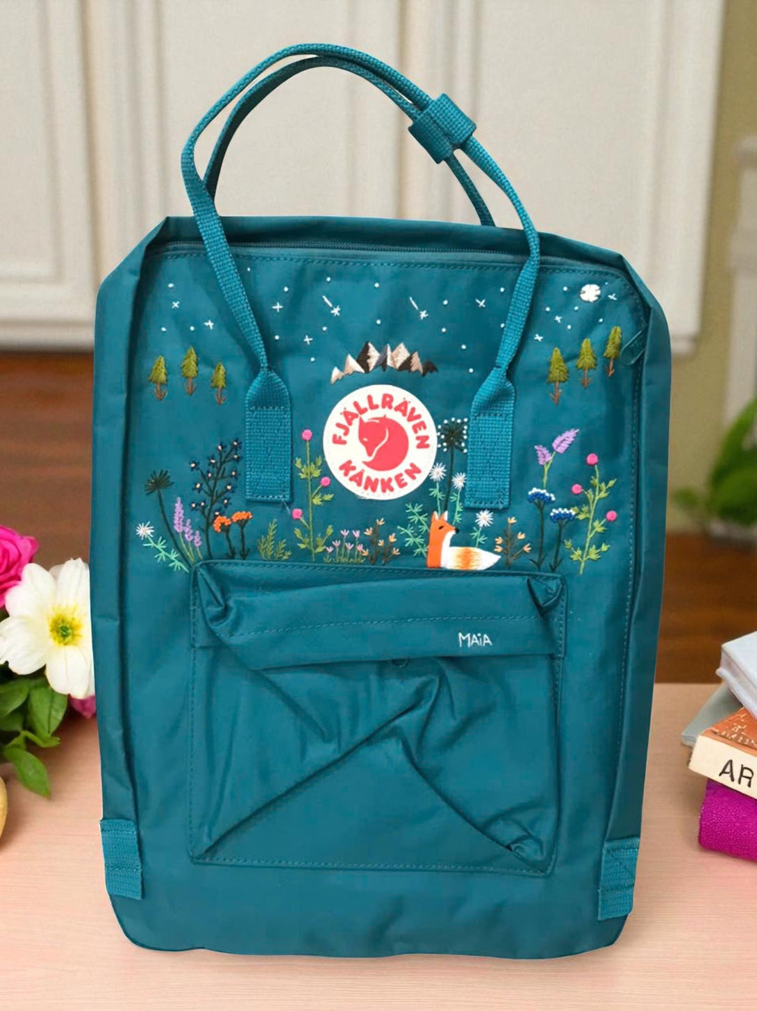 Stitchery Zone teal floral fox embroidered Laptop Backpack with top handles front pocket and mountain logo