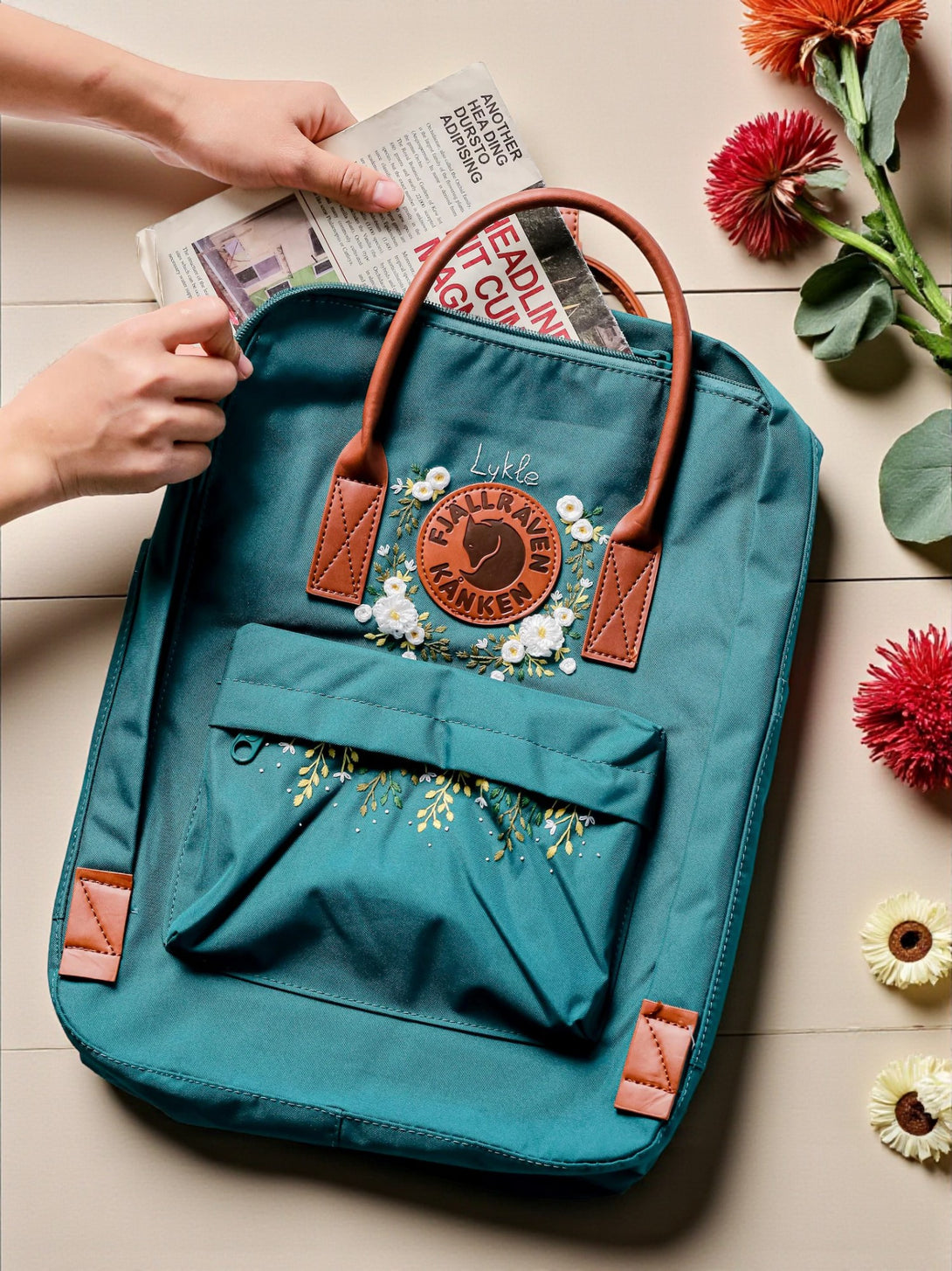 Teal Stitchery Zone school backpack with floral embroidery and leather accents for stylish students